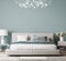 Luxury bright bedroom design, modern white bed and elegant home accessories on pastel blue wall