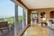 Luxury brown living room with hardwood floors.