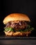 Luxury burger with a brioche bun on black background.
