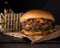 Luxury burger with a brioche bun on black background.