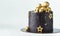 Luxury cake with dark blue cream cheese frosting decorated with golden chocolate stars and spheres. Birthday space themed cake on