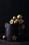 Luxury cake with dark blue cream cheese frosting decorated with golden chocolate stars and spheres. Birthday space themed cake on