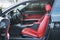 Luxury car interior with red leather seats and black details