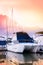 Luxury catamaran yacht dock at the marina with other boats in th