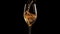 Luxury champagne splashing in crystal wineglass on black background generated by AI