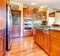 Luxury cherry wood kitchen interior with hardwood.