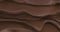 Luxury chocolate background with abstract shapes. The current melted chocolate. Abstract melting wall of brown colorte background.