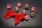 Luxury chocolate pralines, decorated with red tied bow.