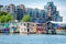 Luxury condominiums tower over colorful house boats