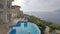 Luxury country house with swimming pool in Kas, Turkey. Couple on Vacation at luxury villa. Aerial view 4K.