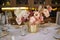 Luxury cozy autumn wedding table decoration in the restaurant. Fresh and dried flowers, roses, carnations. Beautiful table setting