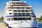 Luxury cruise ship docked in port. Front view of white passenger vessel