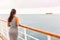 Luxury cruise ship vacation on tropical ocean travel - Young tourist woman watching sunset on deck of cruising boat