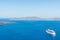 Luxury cruise ships, caldera and volcano near Fira, capital of the Greek Aegean island, Santorini, Greece. Panorama