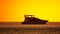 Luxury cruise trip. Red burning sunset over the sea with silhouette of rich yacht. Abstract nature summer ocean sea