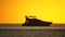 Luxury cruise trip. Red burning sunset over the sea with silhouette of rich yacht. Abstract nature summer ocean sea