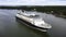 Luxury cruise vessel making way ahead in narrow Finnish archipelago