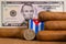 Luxury Cuban cigars with US dollar banknote and coin