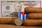 Luxury Cuban cigars with US dollar banknote and coin