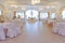 Luxury decorated marriage hall with guests and newlyweds tables
