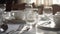 Luxury dining table set with elegant silverware and glassware generated by AI