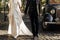 Luxury elegant wedding couple walking and holding hands close up