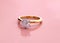 Luxury Engagement Diamond Ring on Pink Background