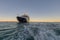 An luxury expedition cruise ship at anchor in the late afternoon in Prince Frederick Harbor on the remote North West Coast of the