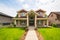 Luxury family house on land terrace with concrete stairway to the entrance