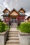 Luxury family house with stairwell over front yard on land terrace