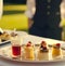 Luxury food service, appetisers by a waiter at a wedding celebration or formal event in classic English style at luxurious hotel