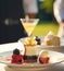Luxury food service, desserts by a waiter at a wedding celebration or formal event in classic English style at luxurious hotel or
