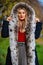 Luxury fur. Beauty and fashion. Woman wear coat with huge furry hood. Fake fur fabric. Elegant girl walk in autumn park