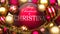 Luxury, golden and red Christmas ornament balls with a phrase christina to show the symbolize warmth and importance of Christmas