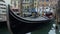 Luxury gondola boats attracting tourists for romantic sightseeing tour in Venice