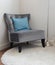 Luxury grey tweed sofa with blue pillow in living room