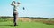 Luxury hobby. Young golf player playing at outdoor course, hitting ball