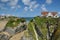 Luxury home on cliffs, tidal sea beach, blue sky