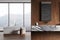Luxury hotel bathroom interior with bathtub and sink, panoramic window