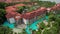 Luxury hotel building with pool, aerial view. Flying around expensive suites