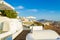 Luxury hotels terraces on Caldera cliff edge Santorini Greece