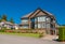 Luxury house in center of the neighbourhood on blue sky background