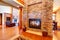 Luxury house interior. Stone wall with fireplace