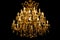 Luxury interior chandelier has light candles and dark background