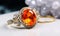 Luxury jewelry made of gold and precious diamonds ring and orange sapphire.