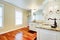 Luxury large white master bathroom with cherry hardwood.