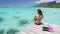 Luxury lifestyle vacation holiday travel bikini woman relaxing after snorkel