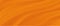 The luxury of light orange fabric texture background.Closeup of rippled orange silk fabric.