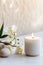 Luxury lighting aromatic scented glass candle display on the grey table in the white bedroom