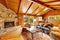 Luxury log cabin house interior. Living room with fireplace and